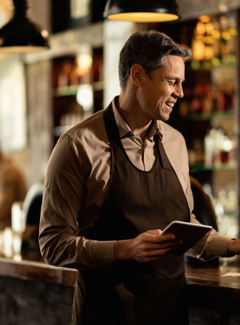 happy-barista-adding-order-cash-register-while-working-pub